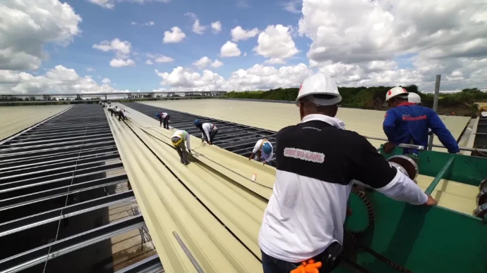 People installing roofing materials